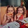 Children eating pizza at Zizzi restaurant